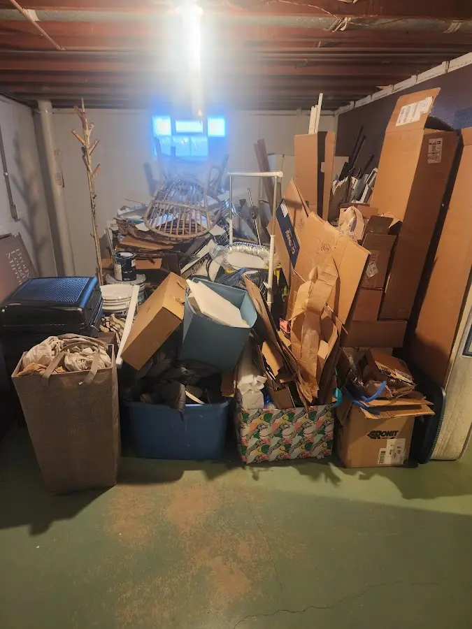 Roll-off dumpster container at job site for 2 Yard Dumpster Rental in Spring