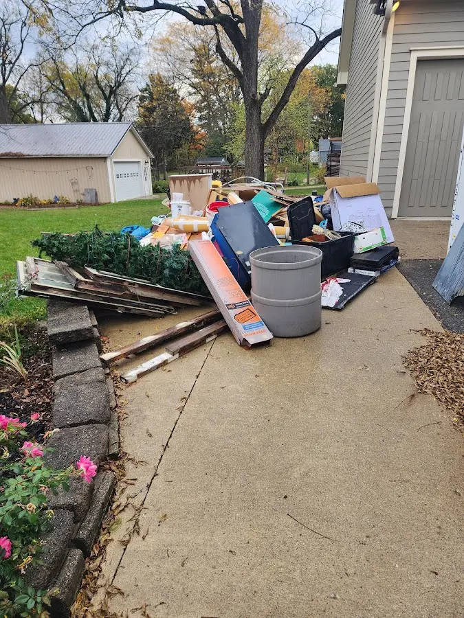 Dumpster being loaded with debris for Residential Dumpster Rental in Spring